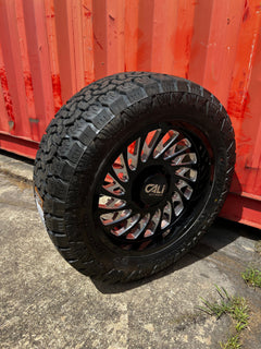 20x9 8x6.5 Cali Offroad Switchback (00) wheels and 33x12.50 Amp Attack A/T Pro tires